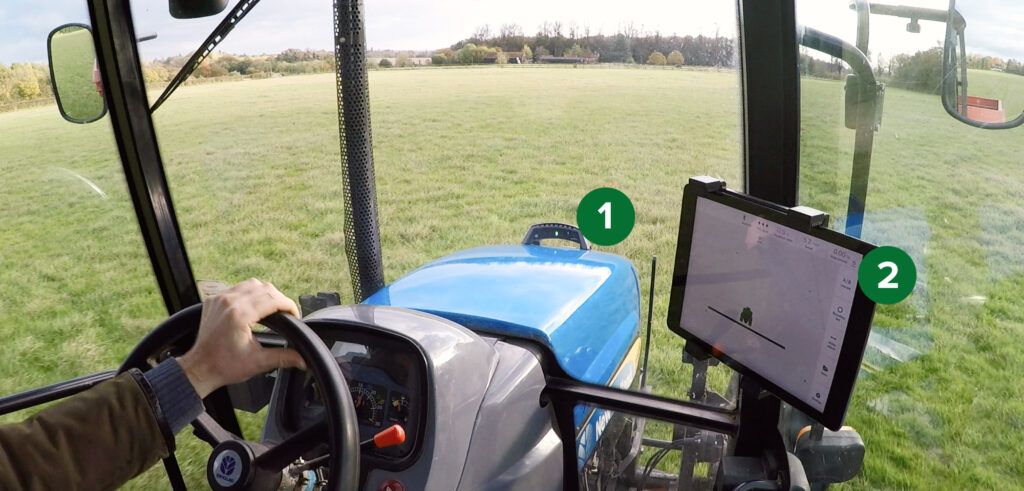 ontrak tractor GPS system on a bonnet or hood showing it connected to an iPad with app in the cab. It is clear and effective on the bonnet.