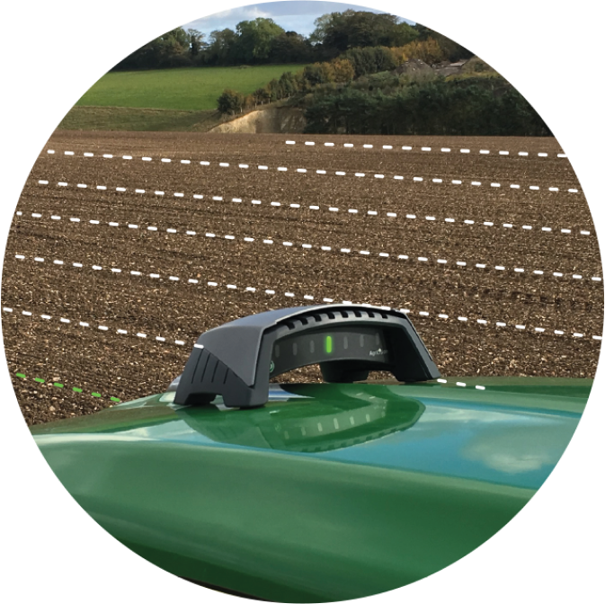 ontrak tractor GPS system on a bonnet or hood showing parallel lines on a field to show you where to drive, so you don't have to guess