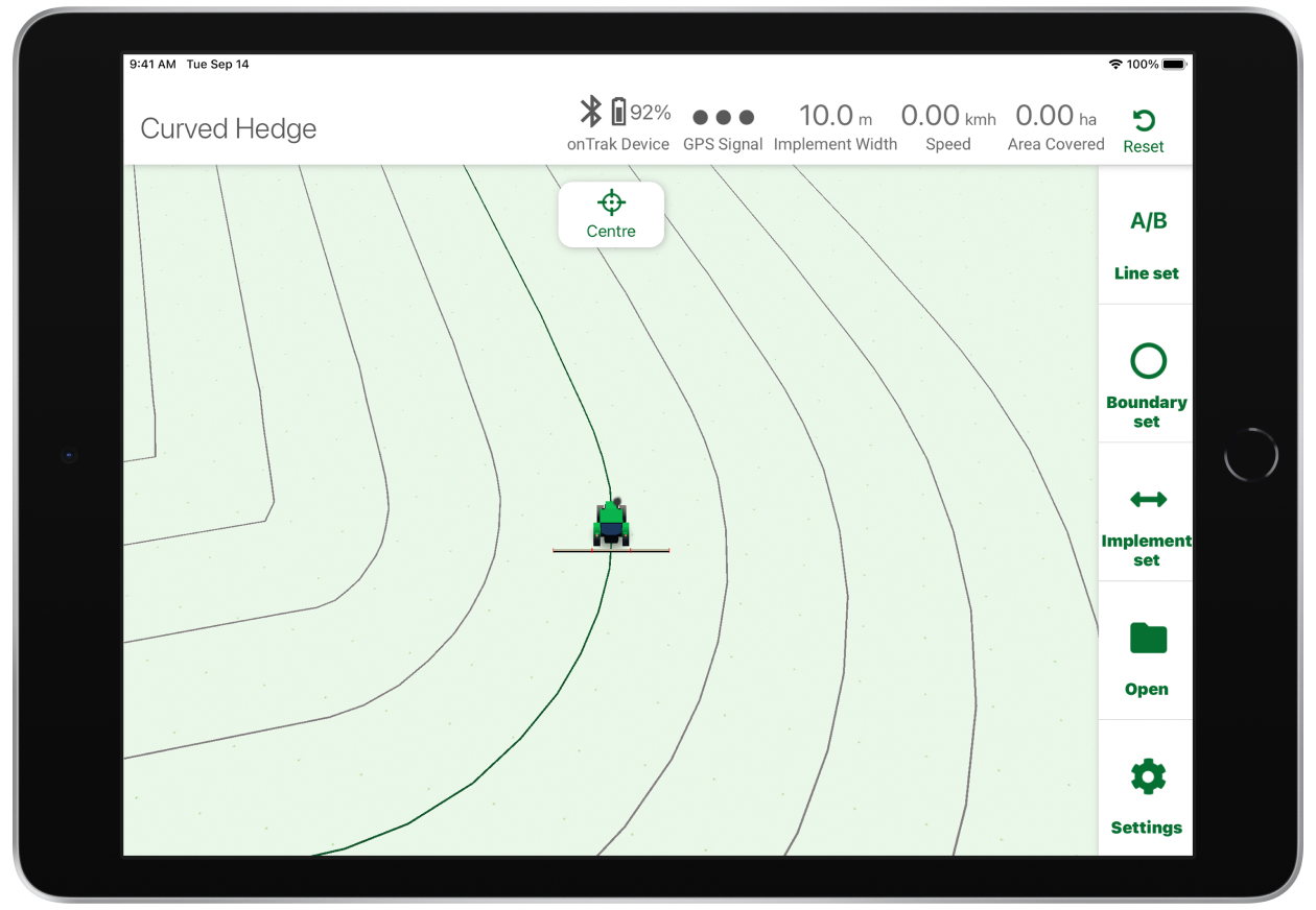 Screenshot of the onTrak app features on iPad driving around a field with curved edges